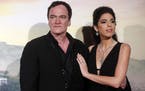 U.S. filmmaker Quentin Tarantino, left, with his wife Daniella Pick, right, attends the Italian Premiere and red carpet of the movie "Once Upon A Time
